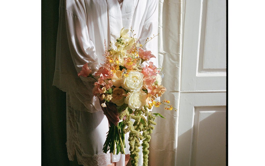 Outdoor Ceremony at Lartington Hall in late summer with pastel florals and Sarah Seven dress